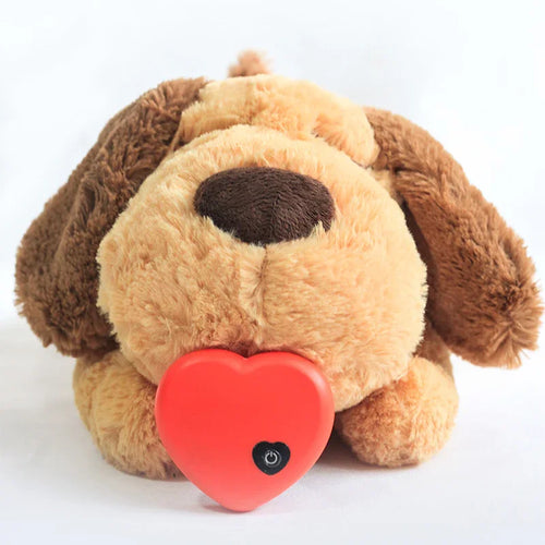 Plush brown dog toy holding a red heart-shaped object with power button symbol