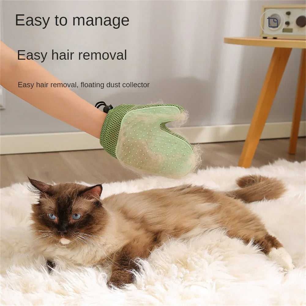 Person using green pet grooming glove to remove loose fur from long-haired cat on rug