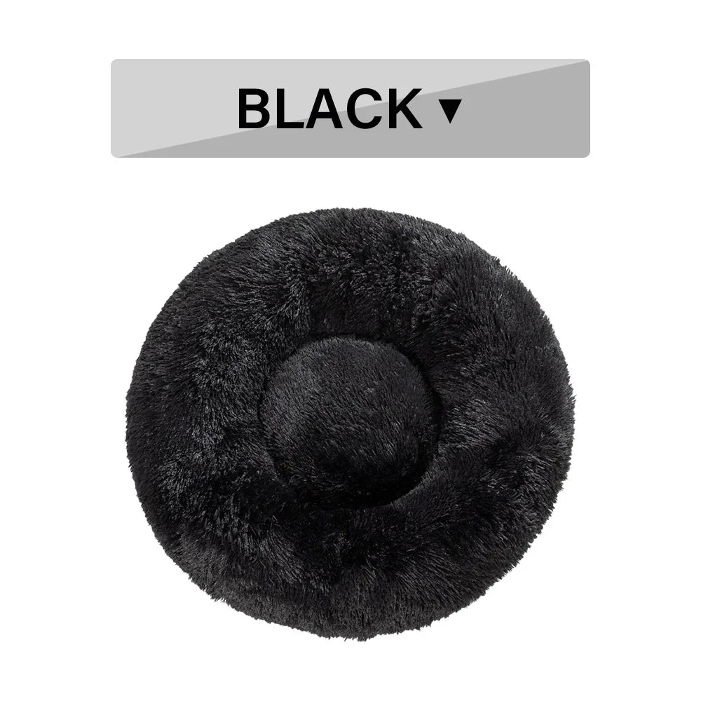 Round black fluffy pet bed with soft plush texture, top view