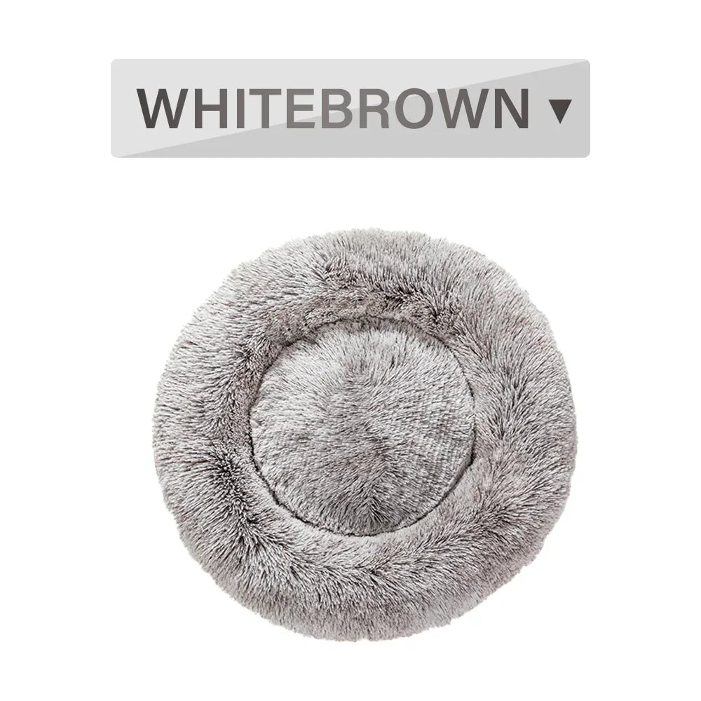 Round plush pet bed in white-brown color with soft fur texture, top view.