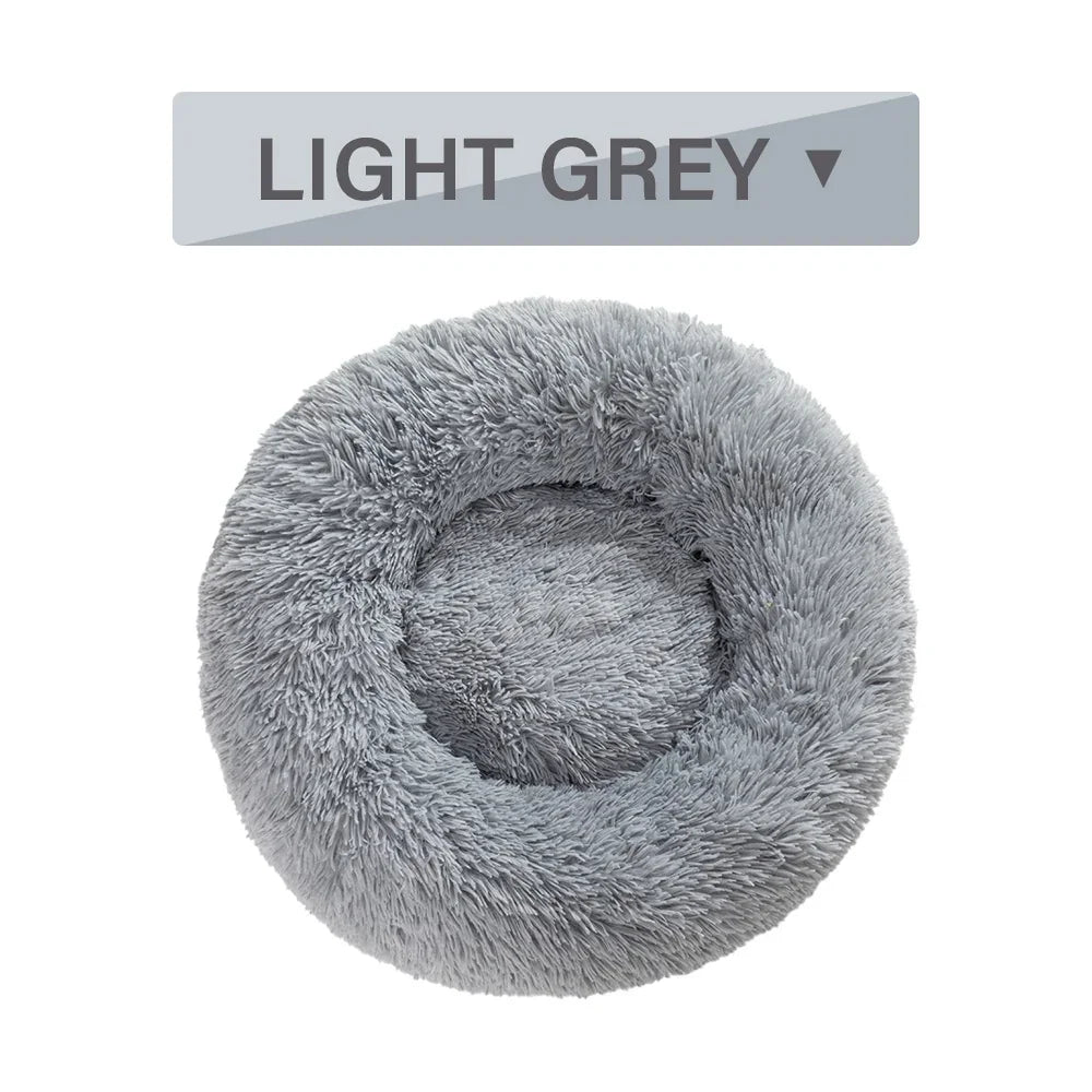 Light grey round fluffy pet bed with raised rim on white background