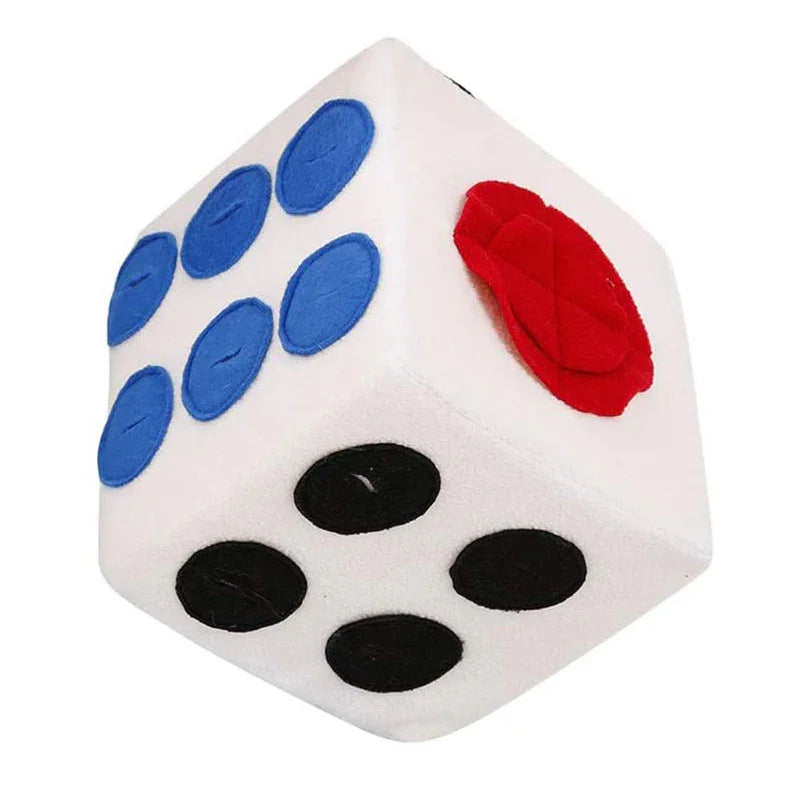 Plush dice toy with blue, black dots and a red textured patch on a white background