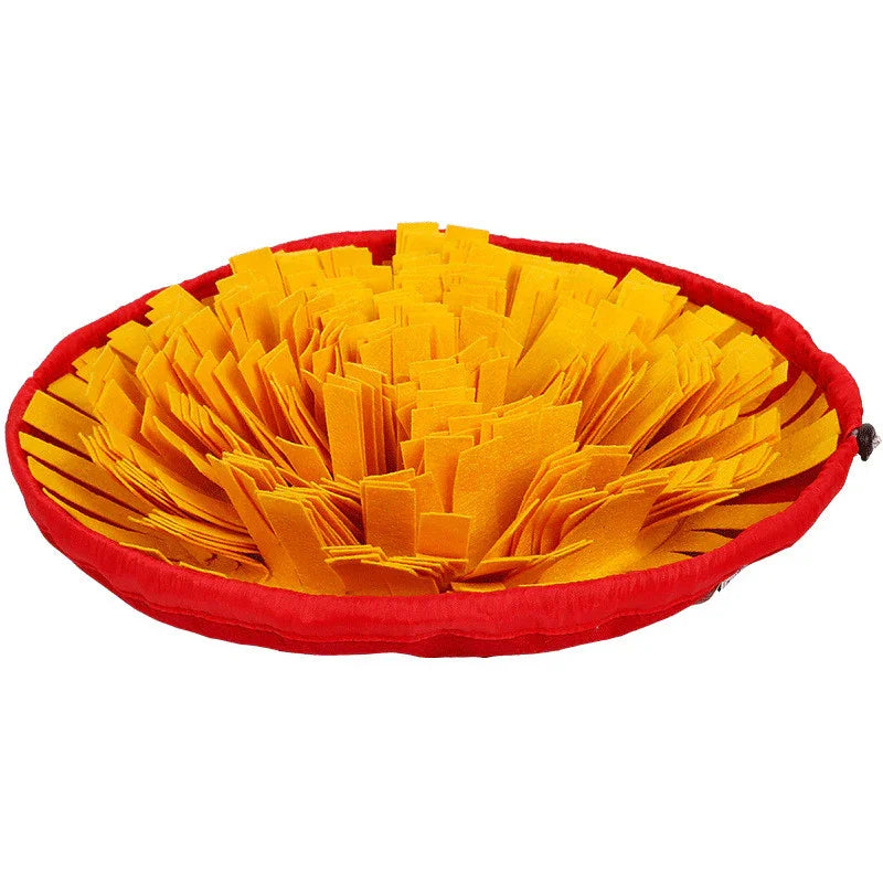 Round yellow and red snuffle mat for pets with dense fabric strips